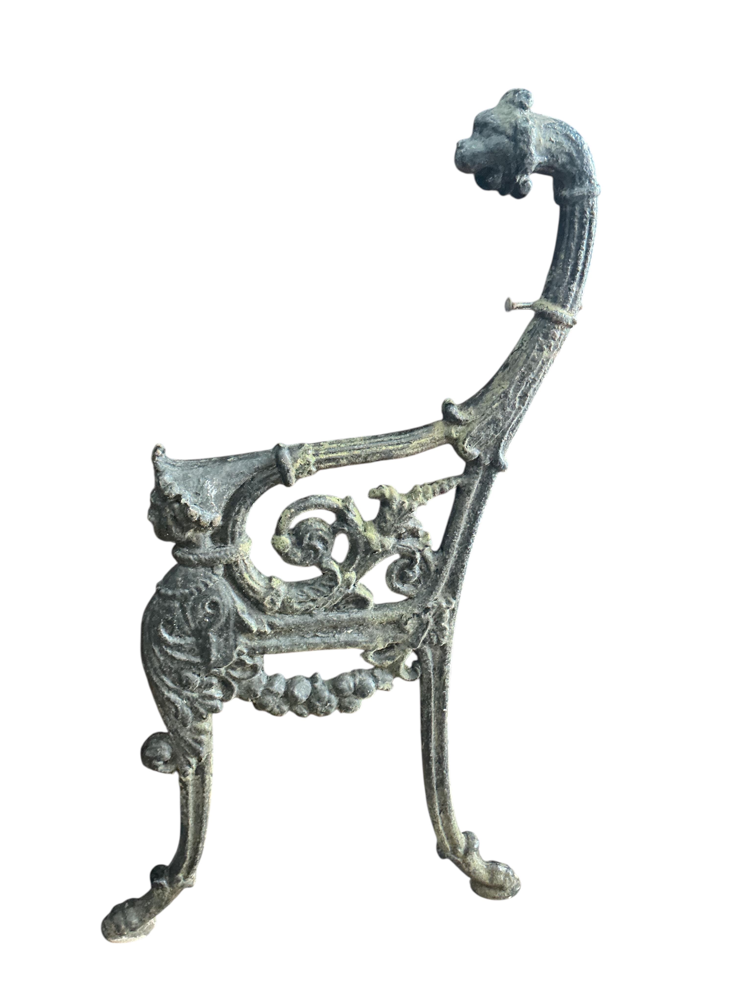 A pair of Victorian cast iron leopard's head bench ends, height 94cm